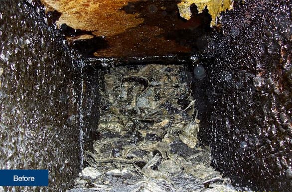 Grease-laden restaurant hood before cleaning services in Los Angeles