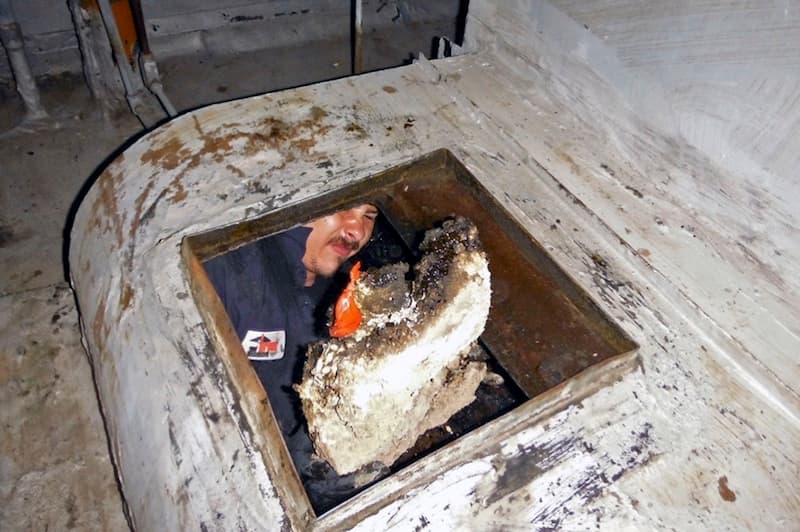 A massive chunk of hardened grease removed from a kitchen exhaust system