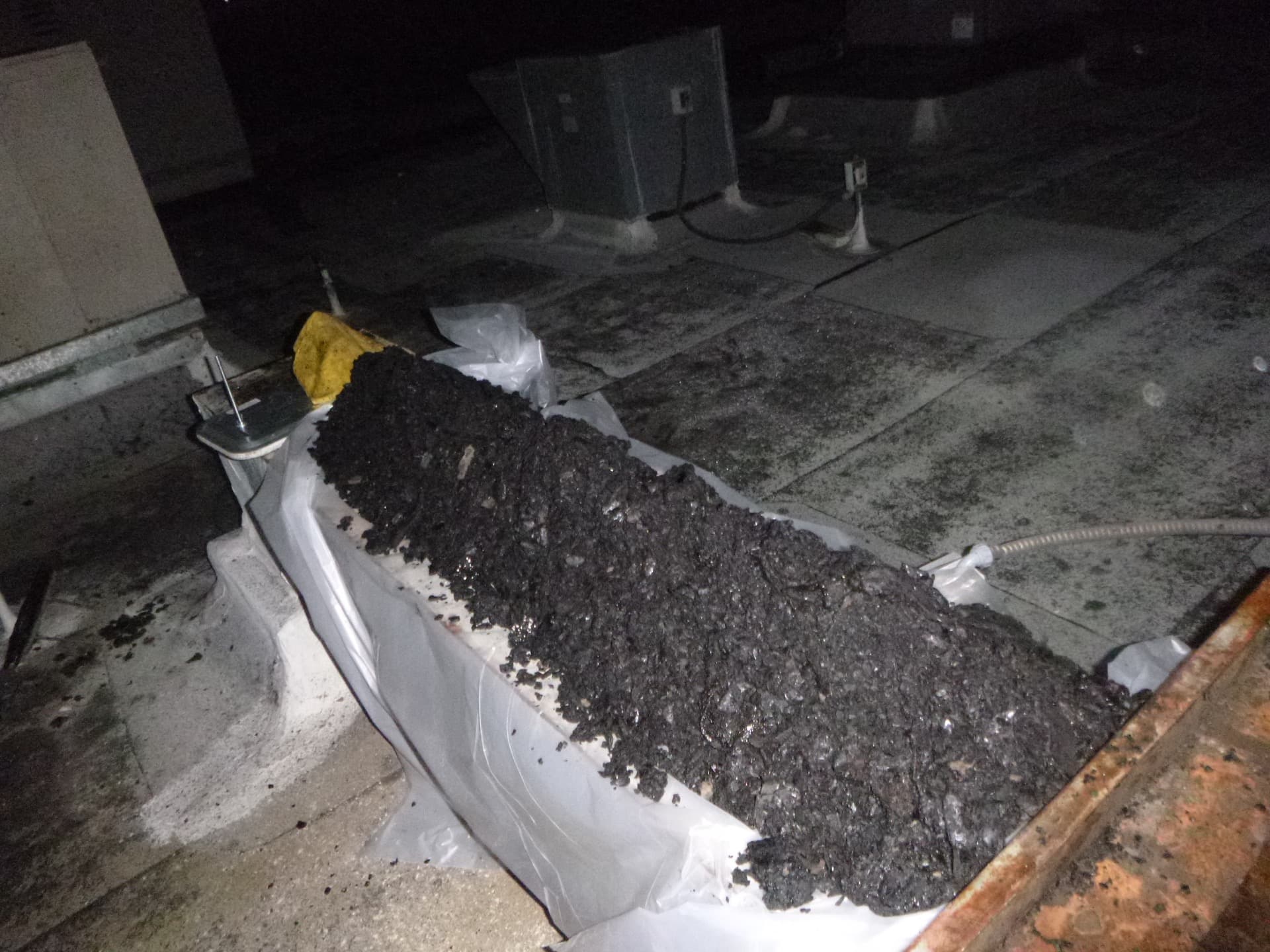 A bucket of grease removed from a restaurant exhaust system
